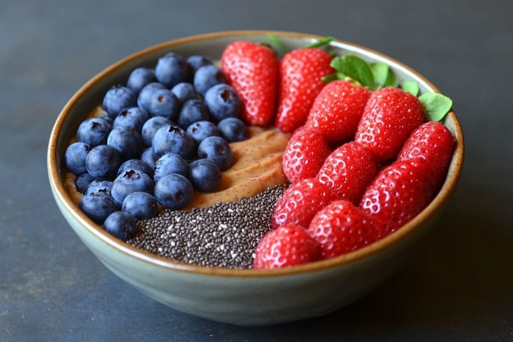 A hearty bowl of oatmeal with berries showcasing what's the healthiest filling breakfast.